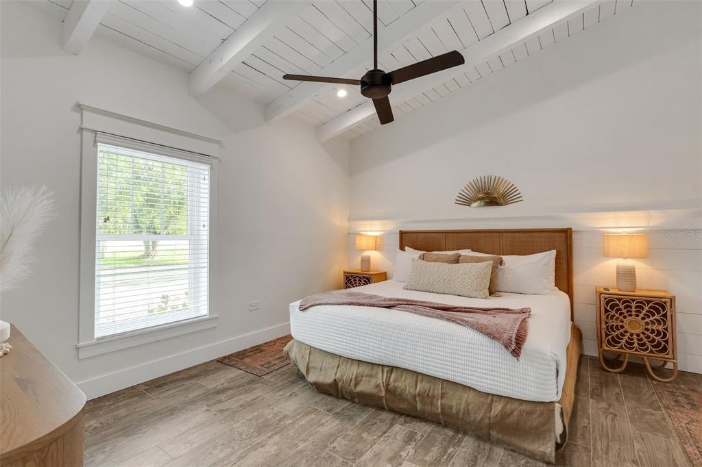 305 73rd Street Holmes Beach, FL 34217 - Photo 48 of 59 a bedroom with a bed and a window