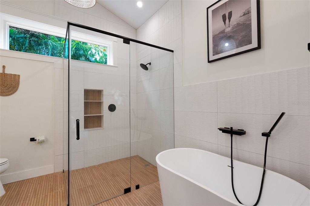 305 73rd Street Holmes Beach, FL 34217 - Photo 54 of 59 a bathroom with a shower