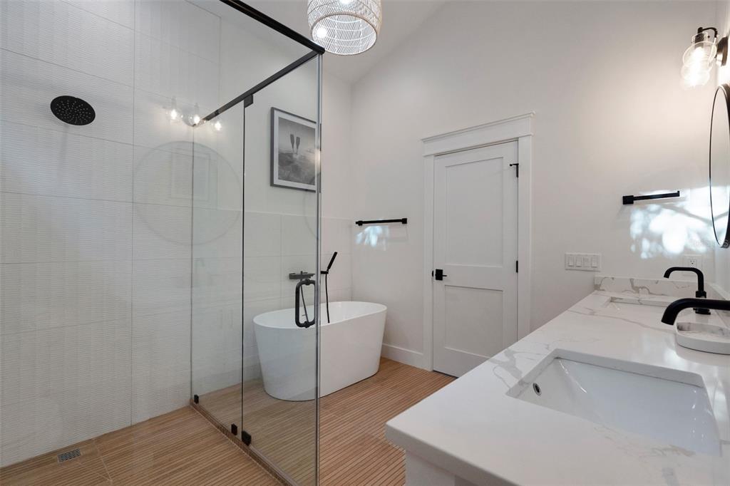 305 73rd Street Holmes Beach, FL 34217 - Photo 56 of 59 a bathroom with a tub sink and mirror