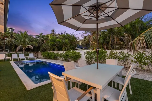 a view of an chairs and table in the patio