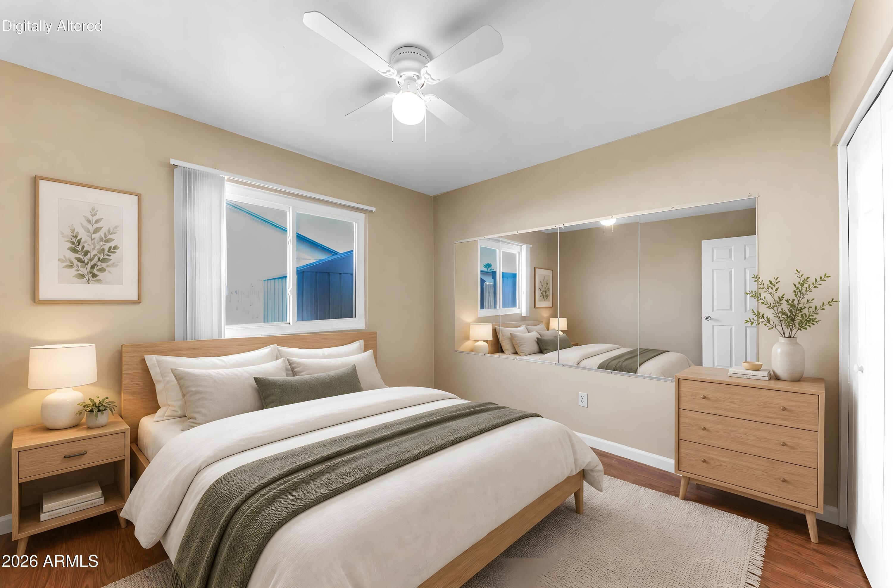 4723 East Vineyard Road Phoenix, AZ 85042 - Photo 21 of 27 a bedroom with bed and window