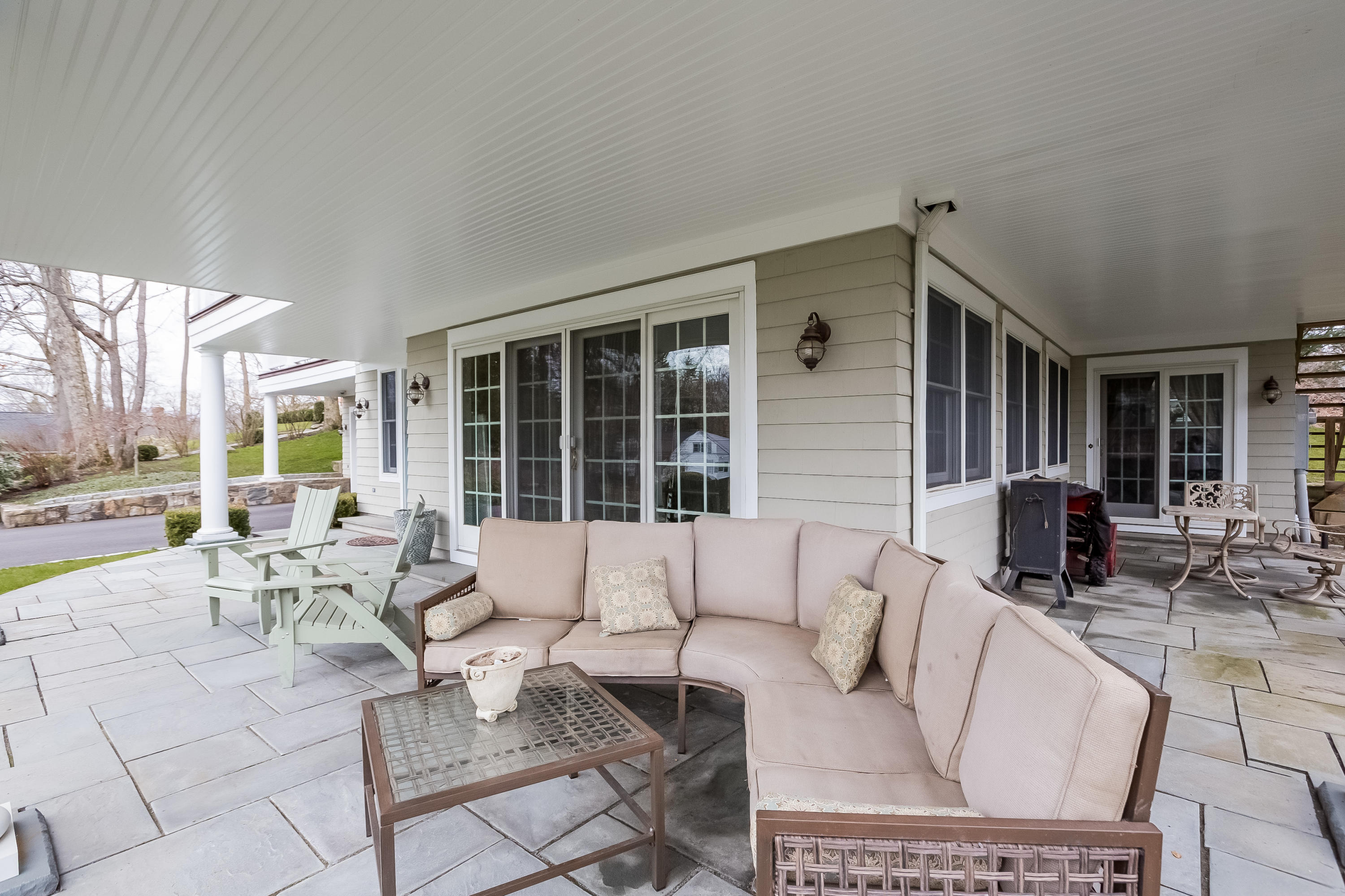 26 Indian Spring Road Rowayton, CT 06853 - Photo 29 of 33 a building outdoor space with patio furniture and potted plants