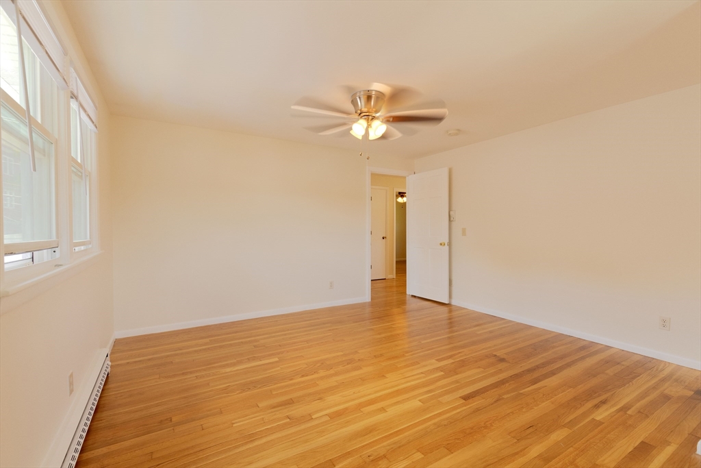 89 Brayton Road, Unit 2 Boston, MA 02135 - Photo 10 of 29 a view of empty room with wooden floor