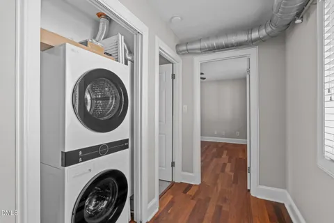 a view of a hallway with washer and dryer