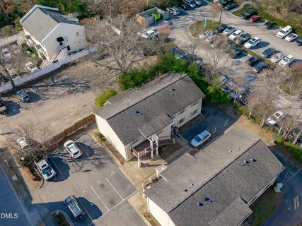 an aerial view of a house with outdoor space