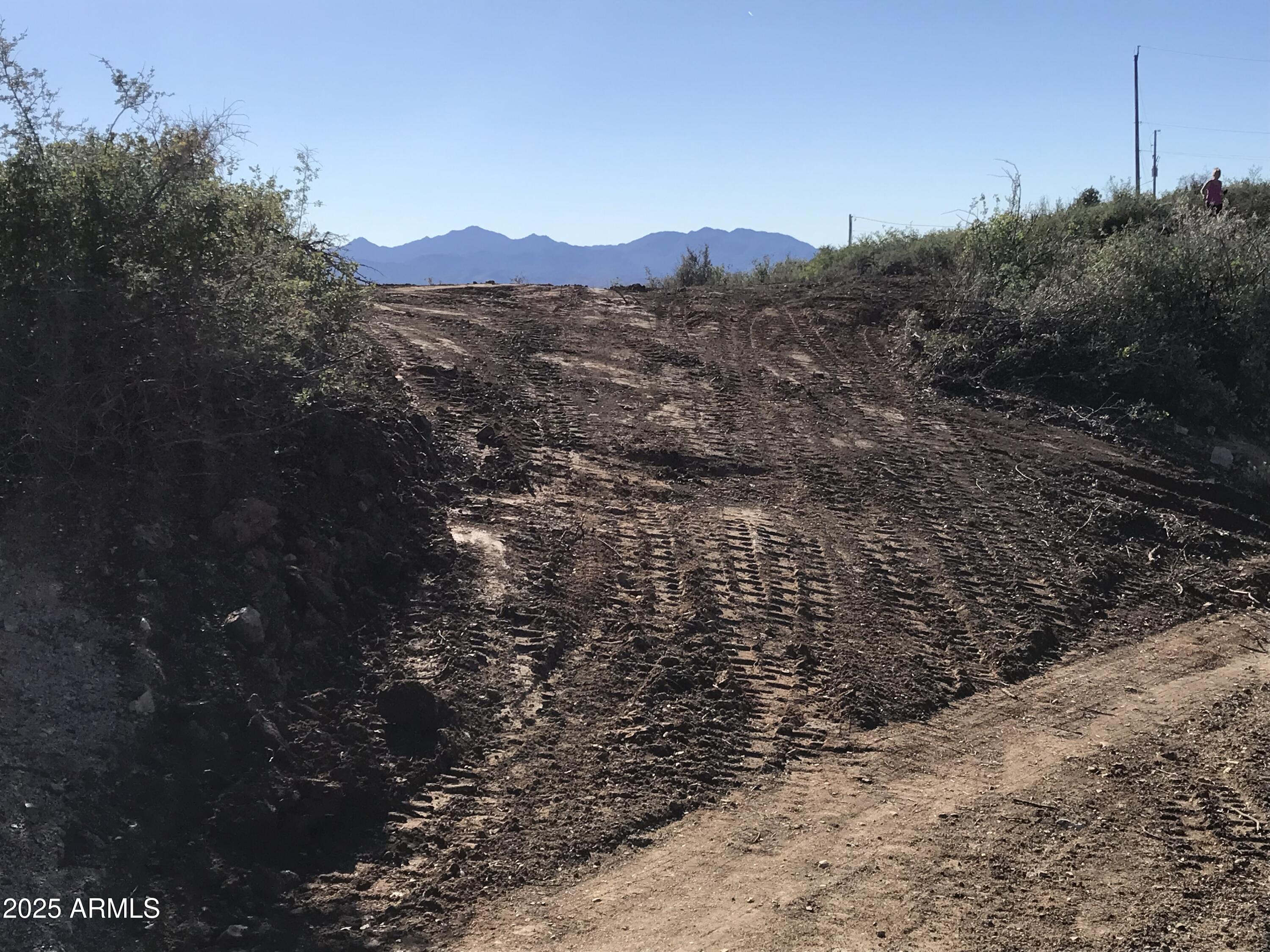 8335 West Barrington Road, Unit 107 Wilhoit, AZ 86332 - Photo 11 of 13 a view of a house with a mountain