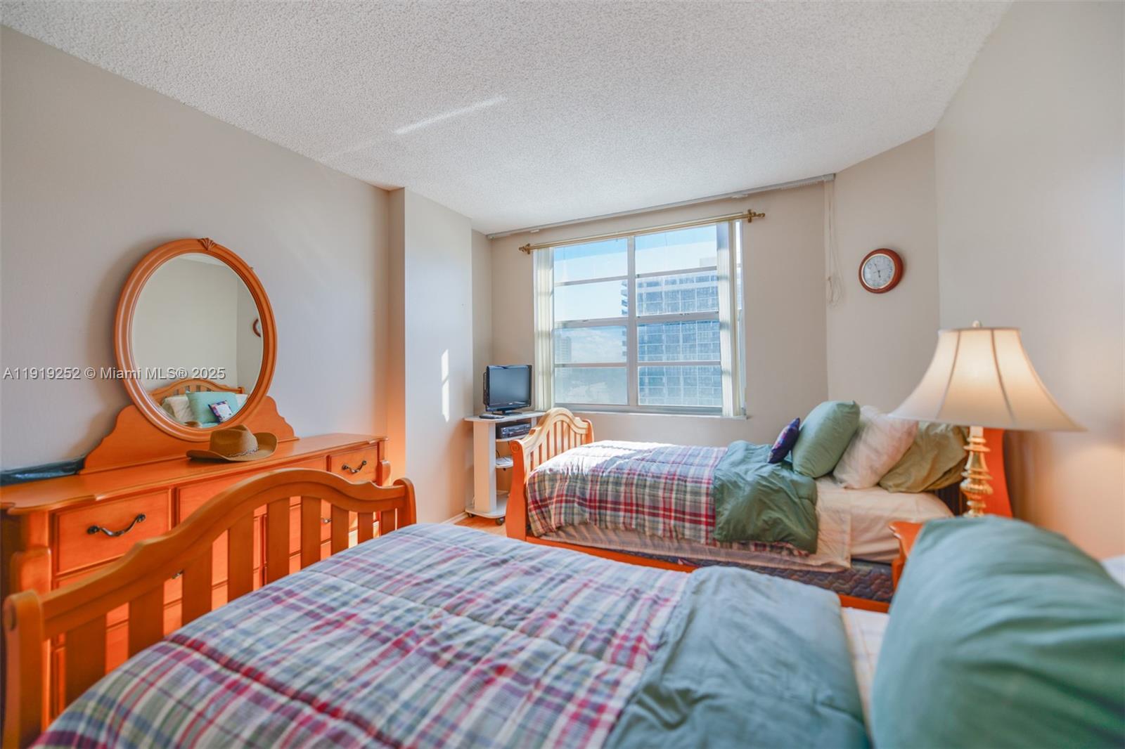 1985 South Ocean Drive, Unit 6J Hallandale Beach, FL 33009 - Photo 21 of 38 a bedroom with a bed and a window