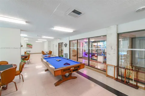 a living room with furniture a table and chairs