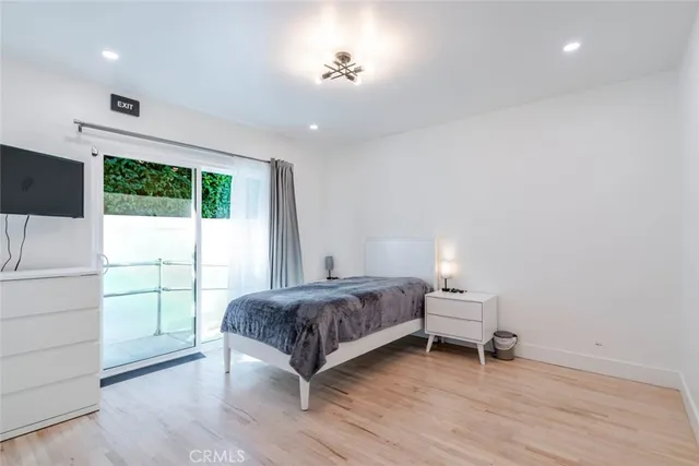 a living room with a bed furniture and a window