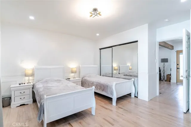 a bedroom with two beds and painted walls