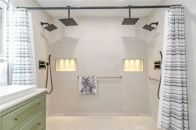 a bathroom with a bathtub and a shower