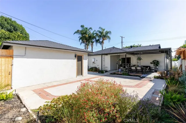 a front view of a house with sitting area