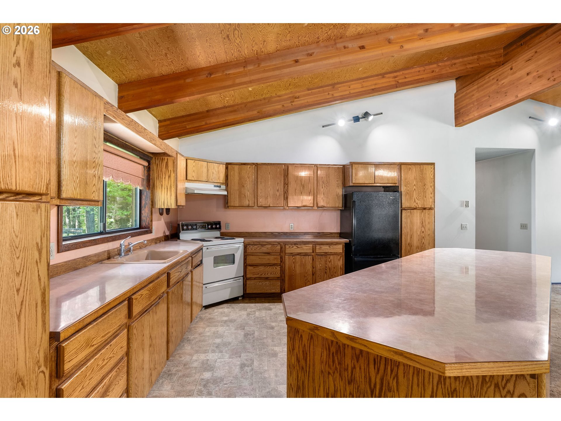 586 Northwest Loop Road White Salmon, WA 98672 - Photo 18 of 48 a kitchen with a stove a sink and a refrigerator