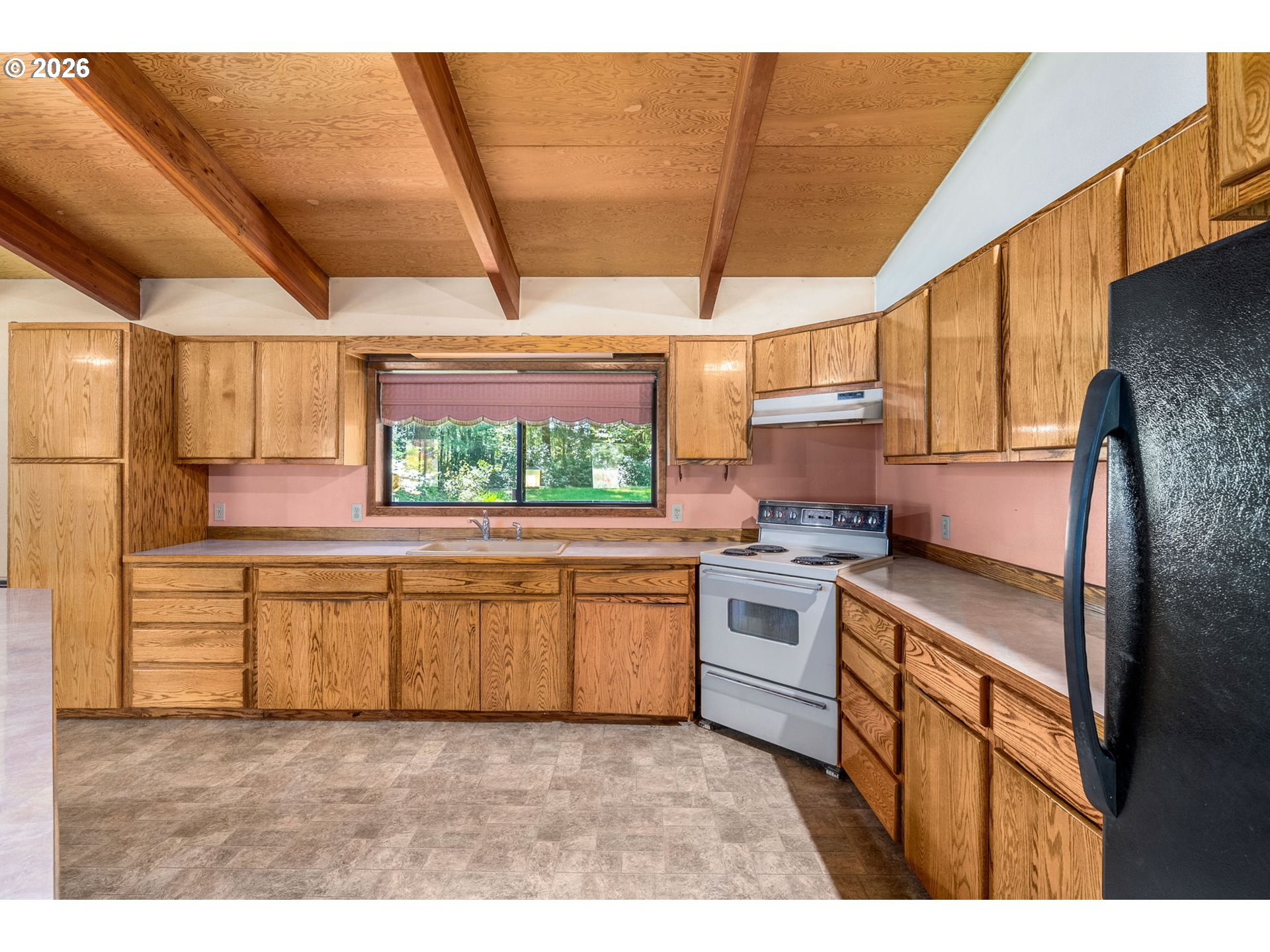 586 Northwest Loop Road White Salmon, WA 98672 - Photo 19 of 48 a kitchen with stainless steel appliances granite countertop a sink and cabinets