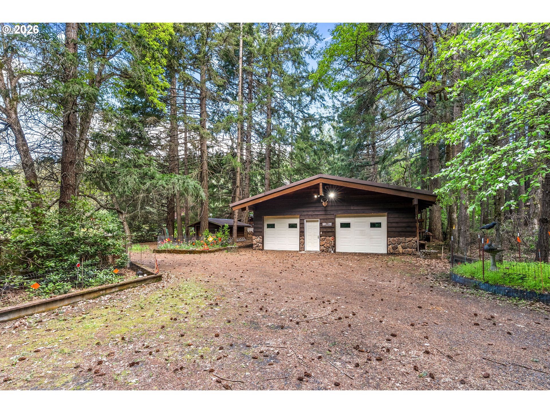 586 Northwest Loop Road White Salmon, WA 98672 - Photo 32 of 48 a view of a house with a yard