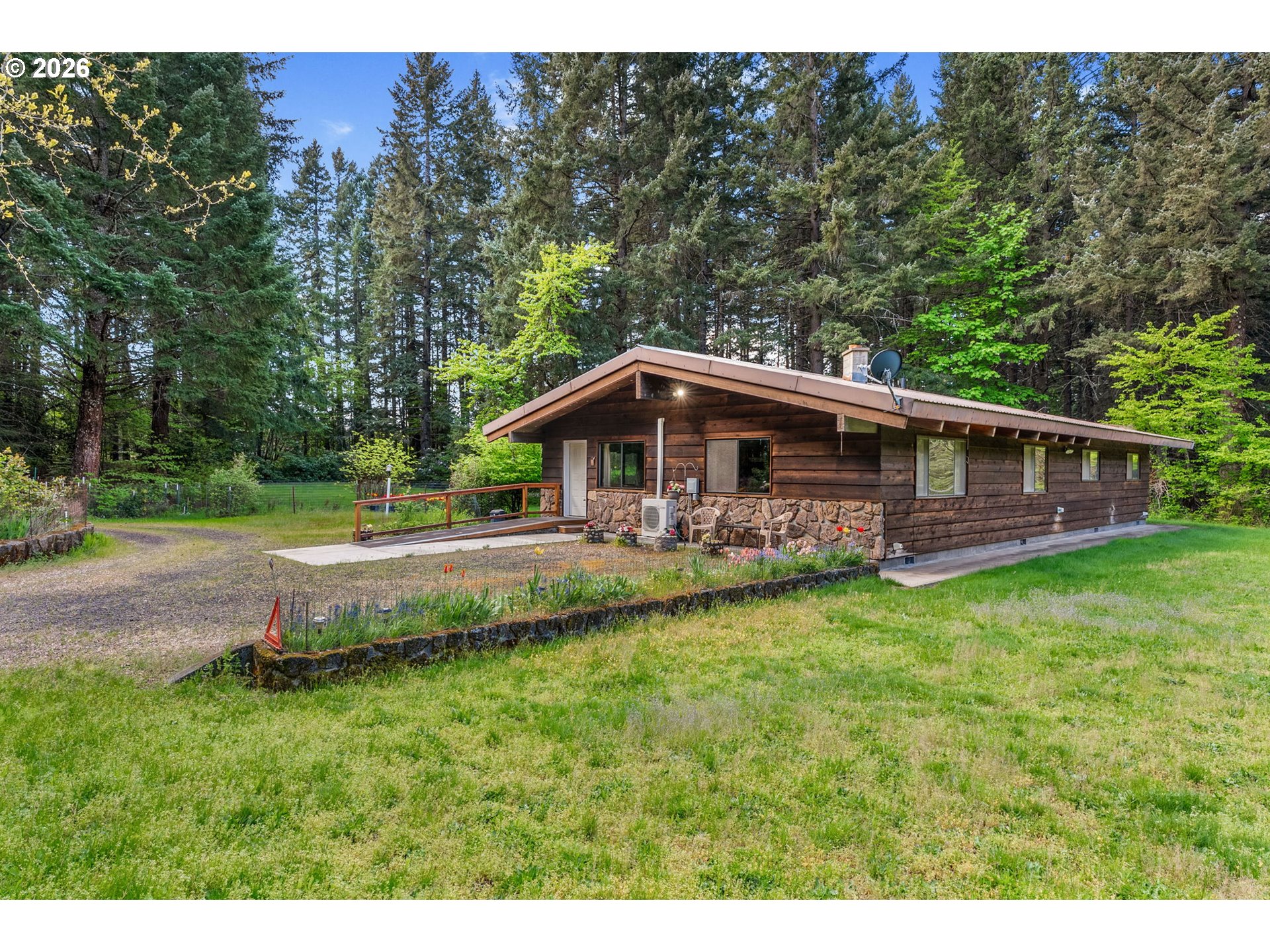 586 Northwest Loop Road White Salmon, WA 98672 - Photo 4 of 48 a view of a house with a backyard