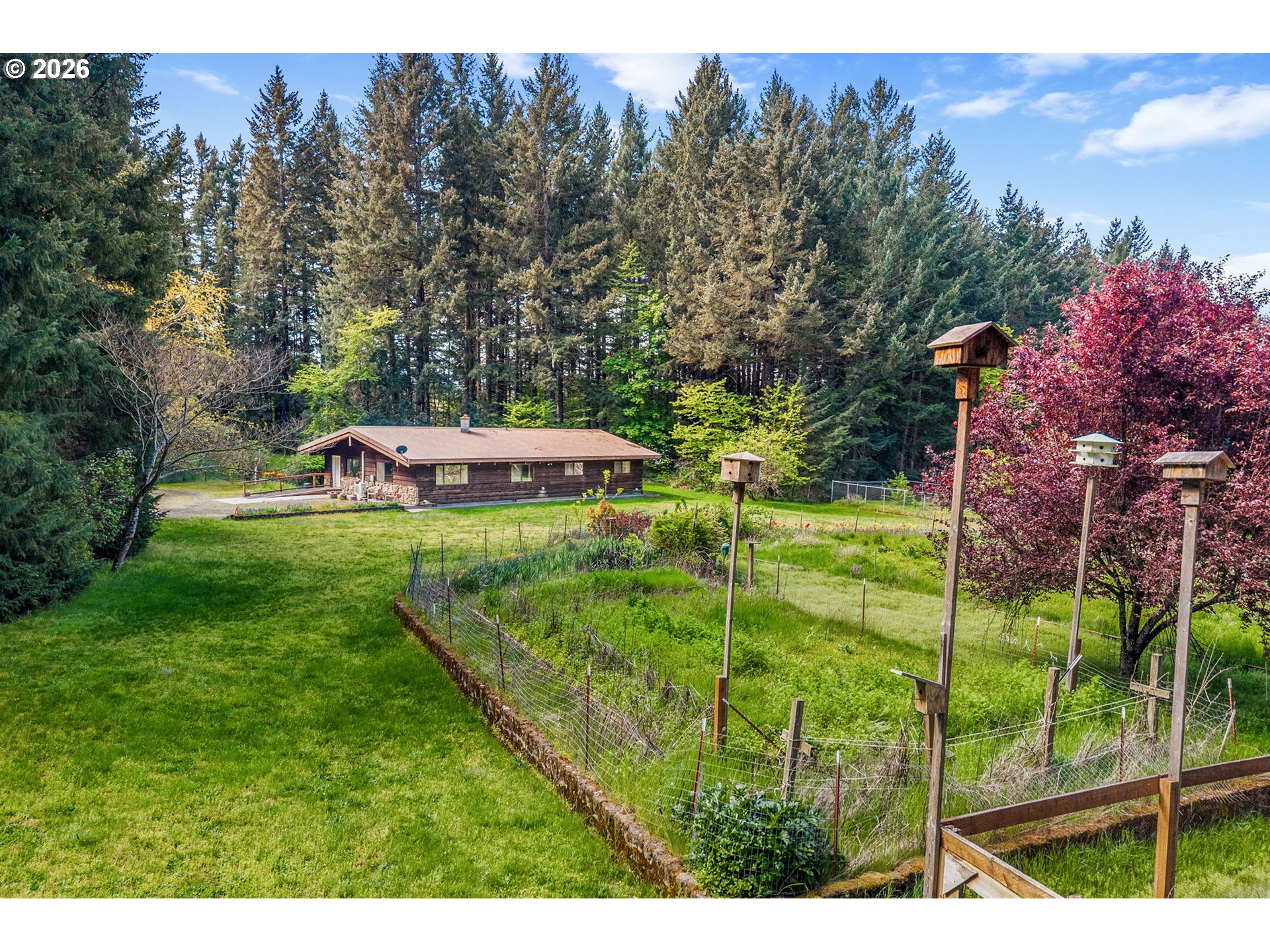 586 Northwest Loop Road White Salmon, WA 98672 - Photo 5 of 48 a view of a garden with an outdoor space