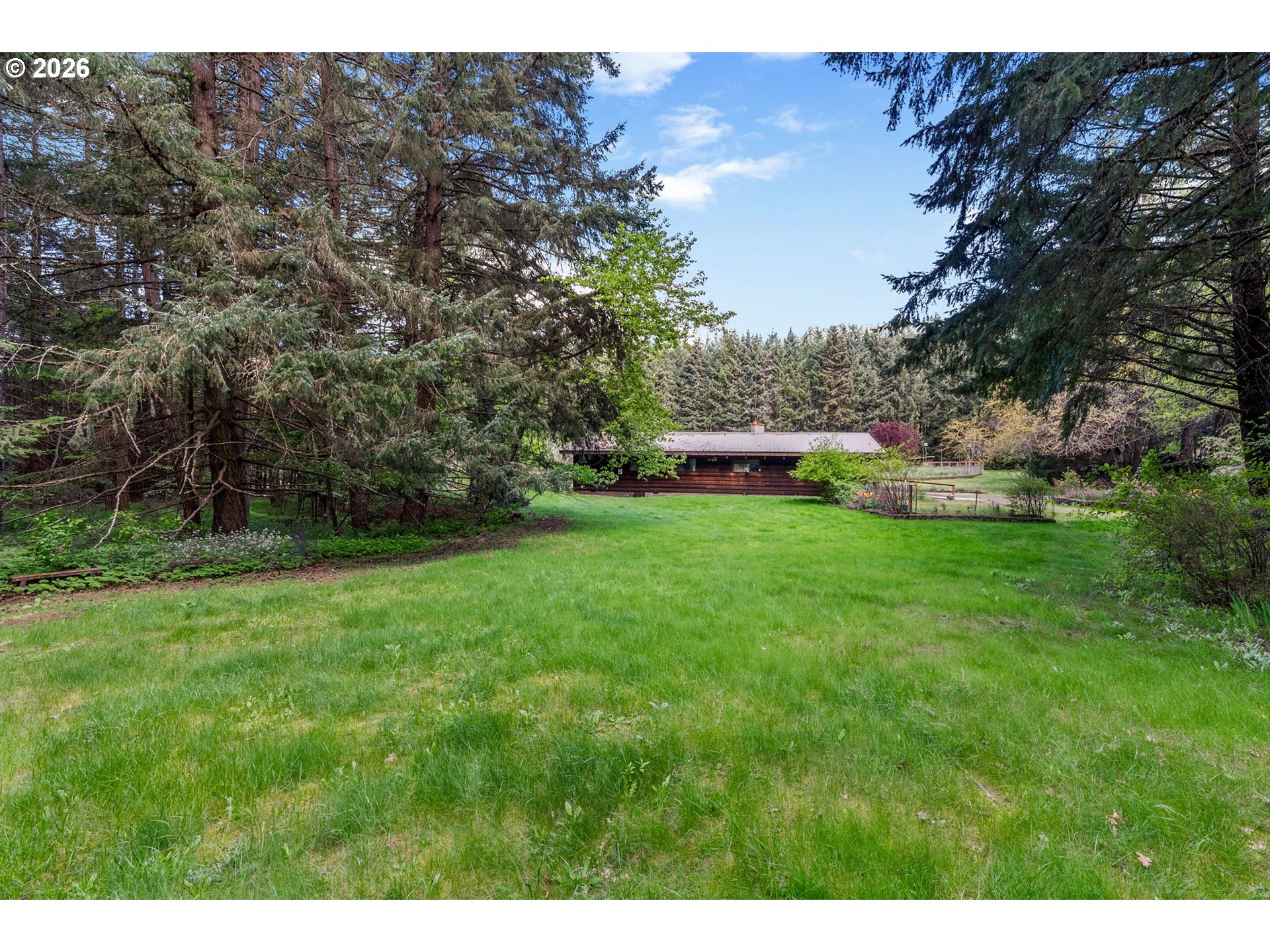 586 Northwest Loop Road White Salmon, WA 98672 - Photo 7 of 48 a view of a backyard with a garden