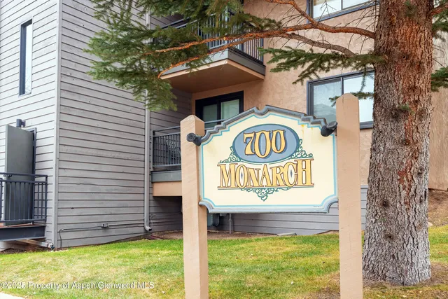 a sign that is on a brick wall