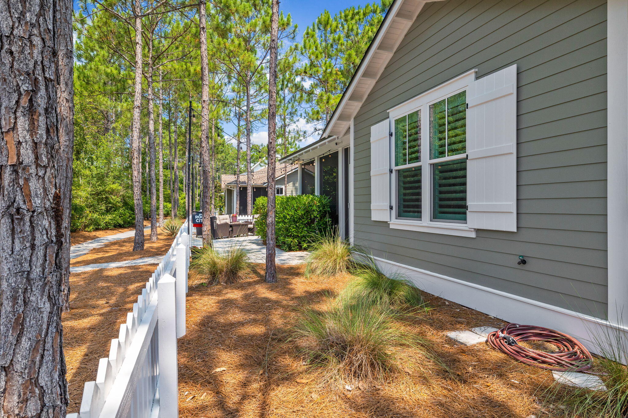 227 Jack Knife Drive Inlet Beach, FL 32461 - Photo 11 of 54 a view of a house with backyard and sitting area