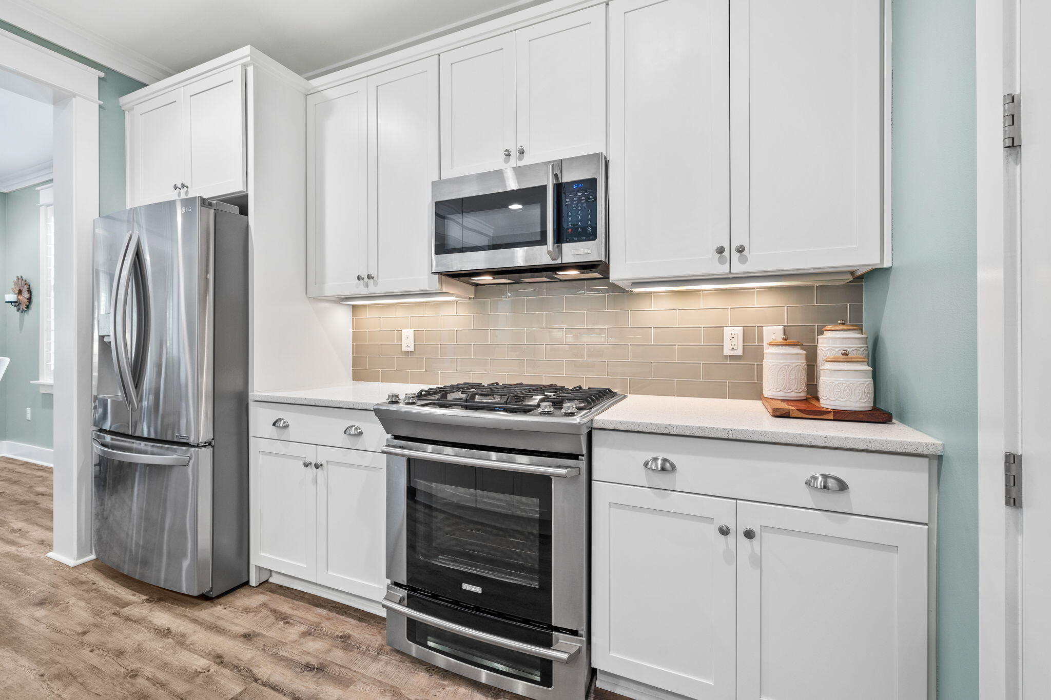 227 Jack Knife Drive Inlet Beach, FL 32461 - Photo 22 of 54 a kitchen with stainless steel appliances white cabinets and a stove top oven