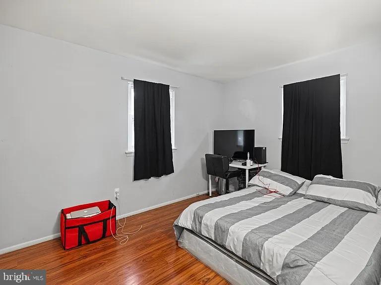 5007 Odessa Road College Park, MD 20740 - Photo 11 of 20 a bedroom with a bed and a television