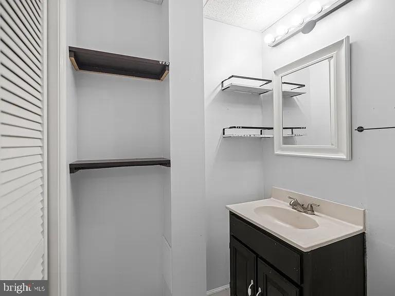 5007 Odessa Road College Park, MD 20740 - Photo 17 of 20 a bathroom with a sink and mirror