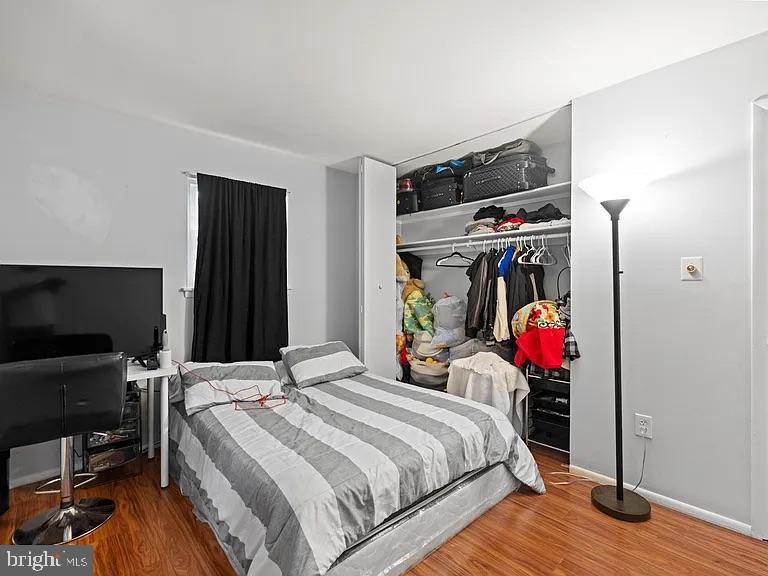 5007 Odessa Road College Park, MD 20740 - Photo 10 of 20 a bed room with a bed and a flat screen tv