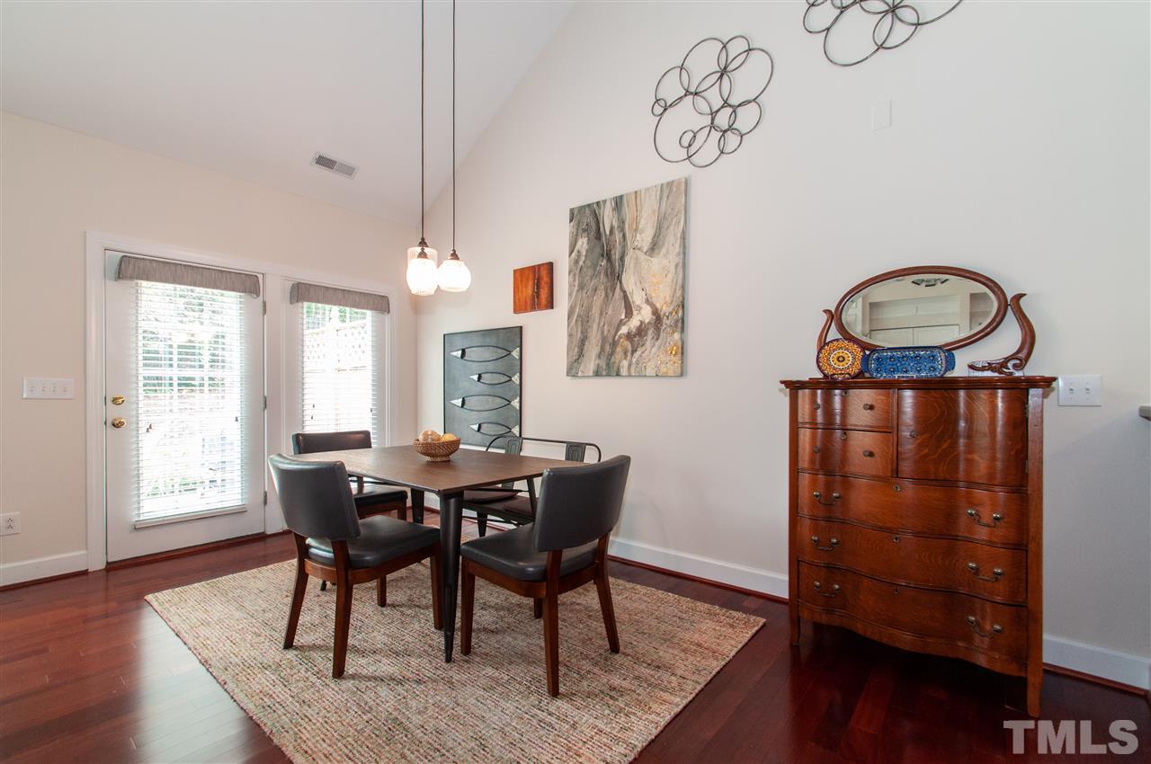 3615 Lion Ridge Court Raleigh, NC 27612 - Photo 14 of 30 a view of a dining room with furniture and wooden floor
