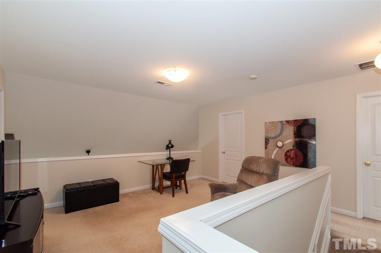 3615 Lion Ridge Court Raleigh, NC 27612 - Photo 16 of 30 a living room with furniture and a piano
