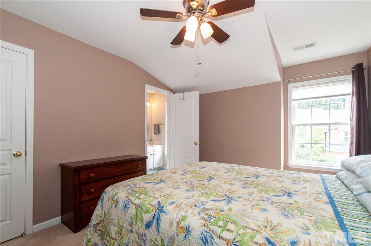 3615 Lion Ridge Court Raleigh, NC 27612 - Photo 23 of 30 a bedroom with a bed and a window