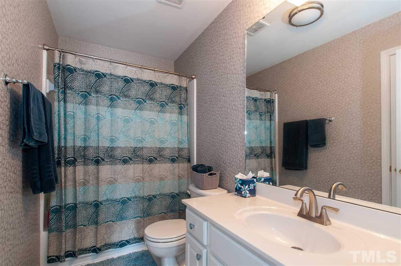 3615 Lion Ridge Court Raleigh, NC 27612 - Photo 26 of 30 a bathroom with a sink toilet and shower