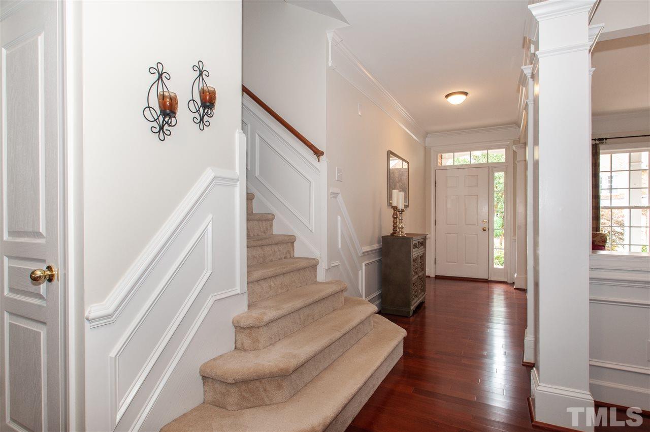 3615 Lion Ridge Court Raleigh, NC 27612 - Photo 28 of 30 a view of entryway with wooden floor and stairs