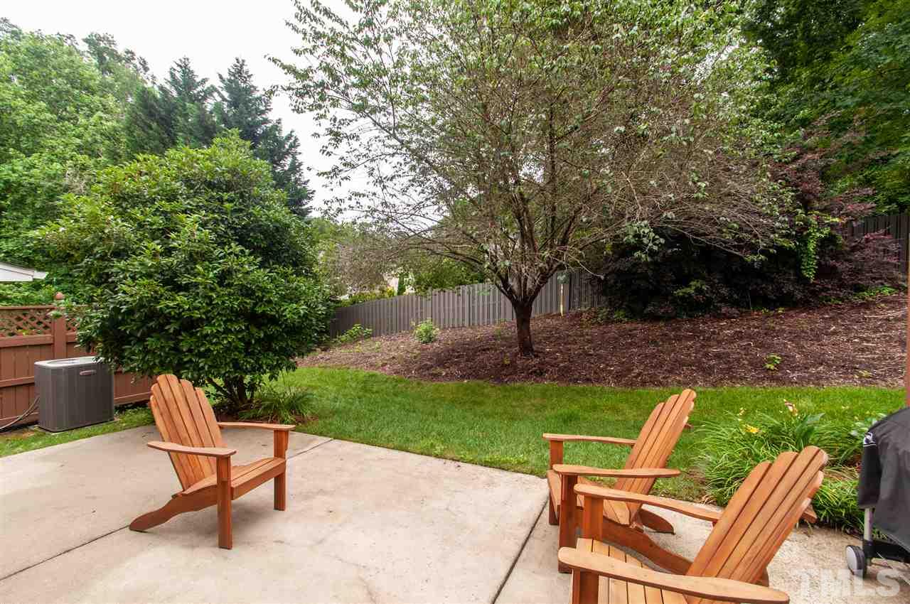 3615 Lion Ridge Court Raleigh, NC 27612 - Photo 29 of 30 a view of backyard with outdoor seating and green space
