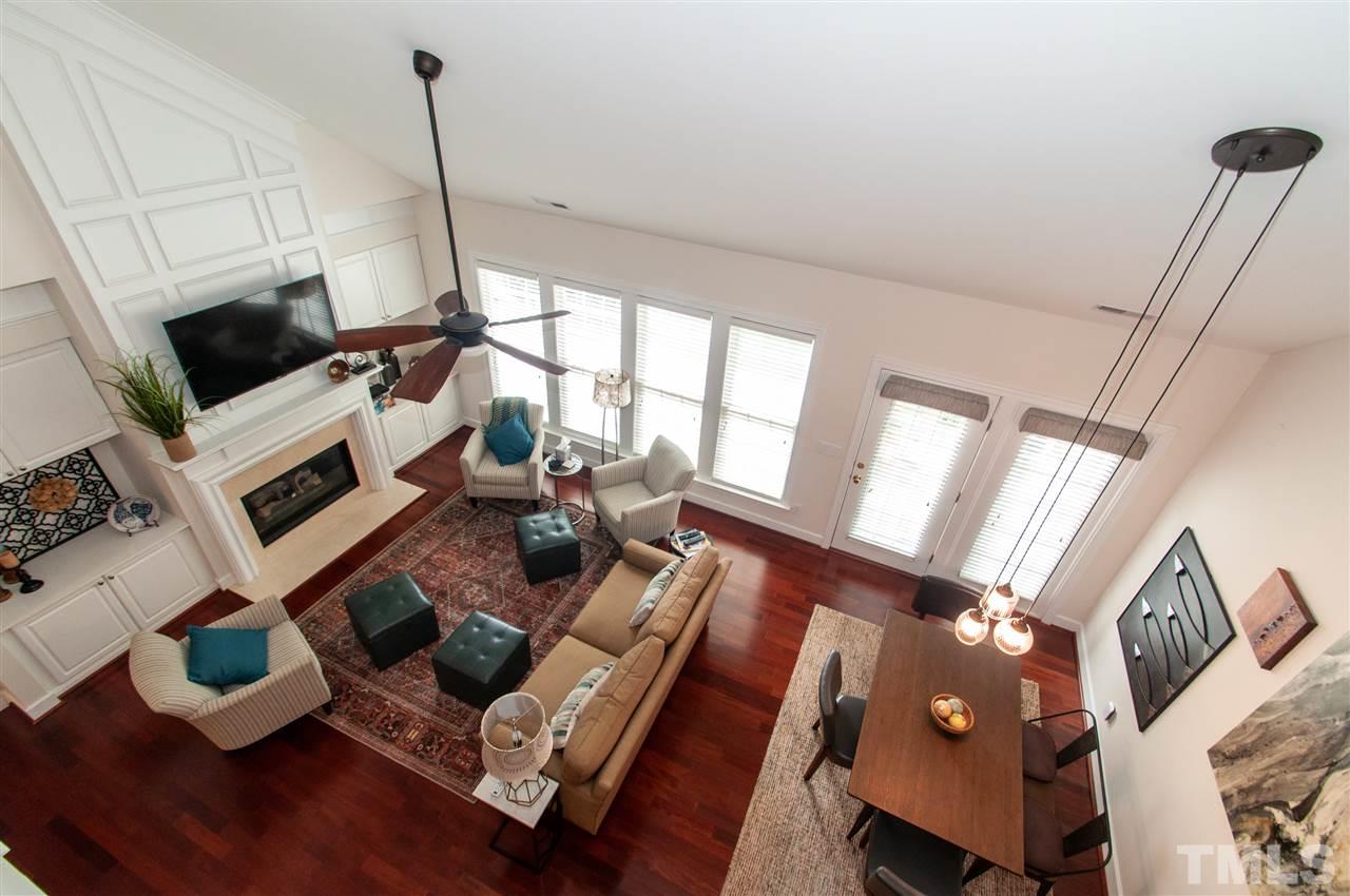 3615 Lion Ridge Court Raleigh, NC 27612 - Photo 5 of 30 a living room with furniture and a flat screen tv