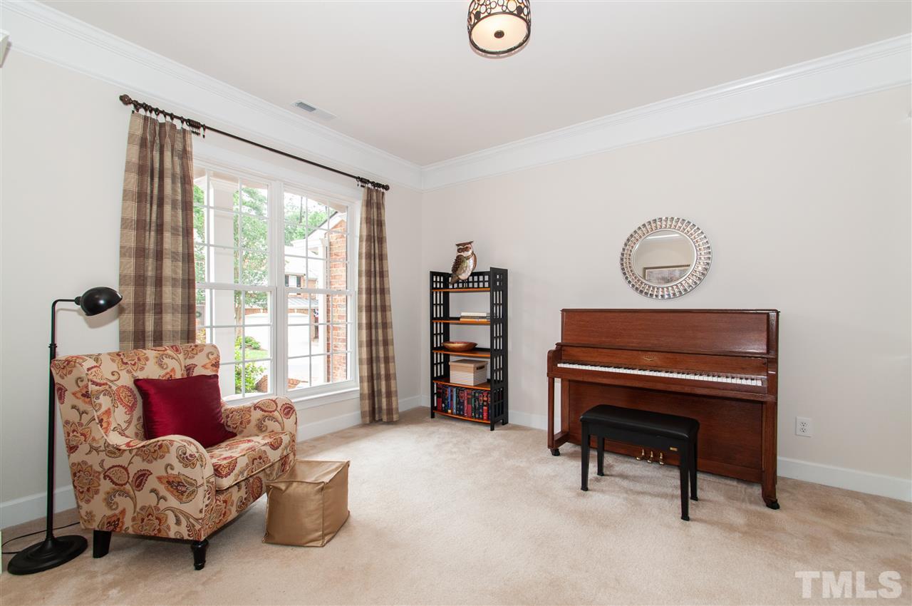 3615 Lion Ridge Court Raleigh, NC 27612 - Photo 6 of 30 a living room with furniture and a piano