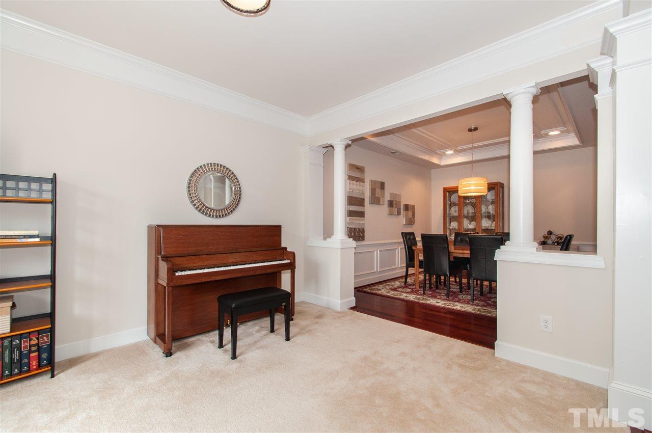 3615 Lion Ridge Court Raleigh, NC 27612 - Photo 7 of 30 a living room with furniture and a piano