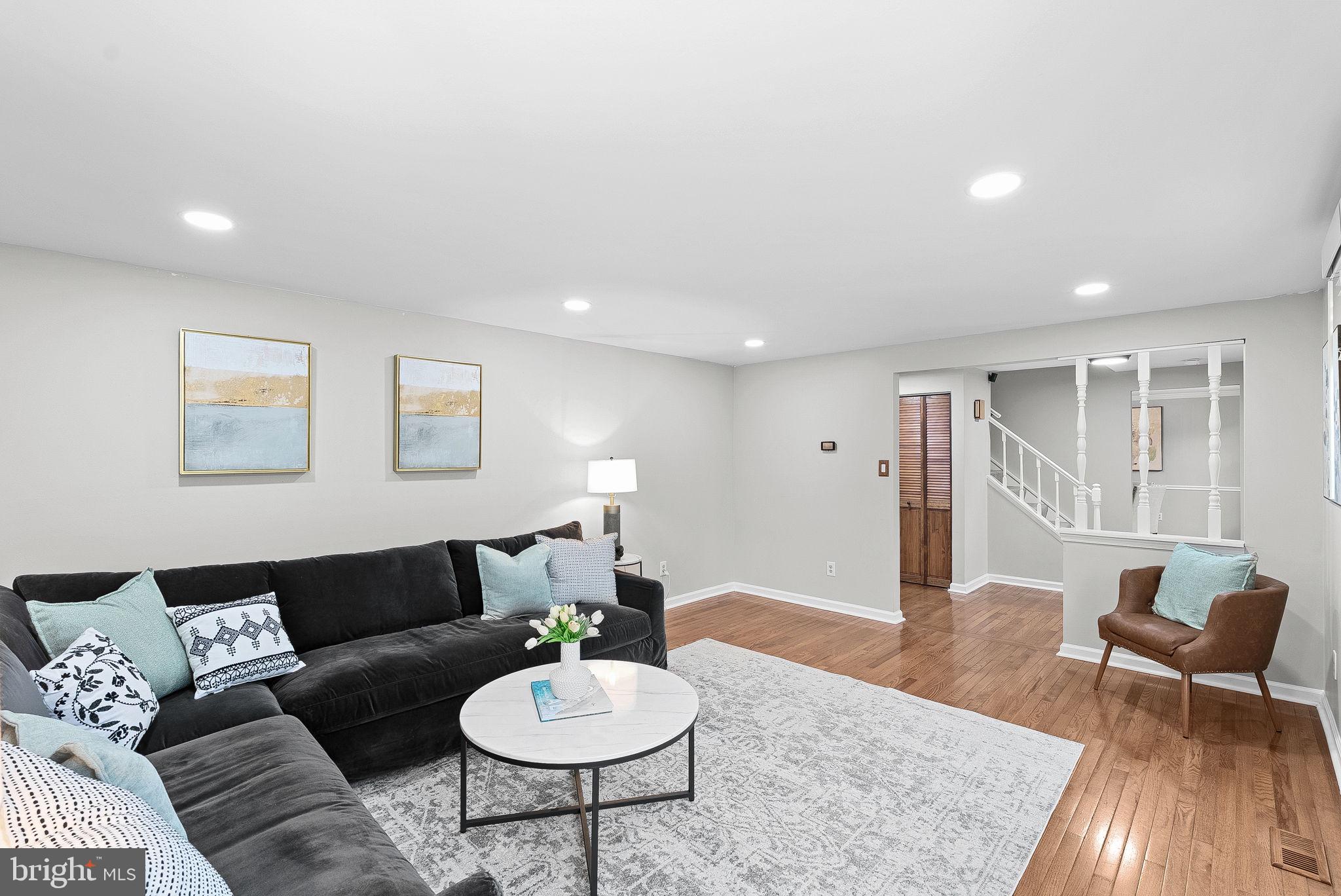 128 Applegate Drive Sterling, VA 20164 - Photo 12 of 58 a living room with furniture and wooden floor