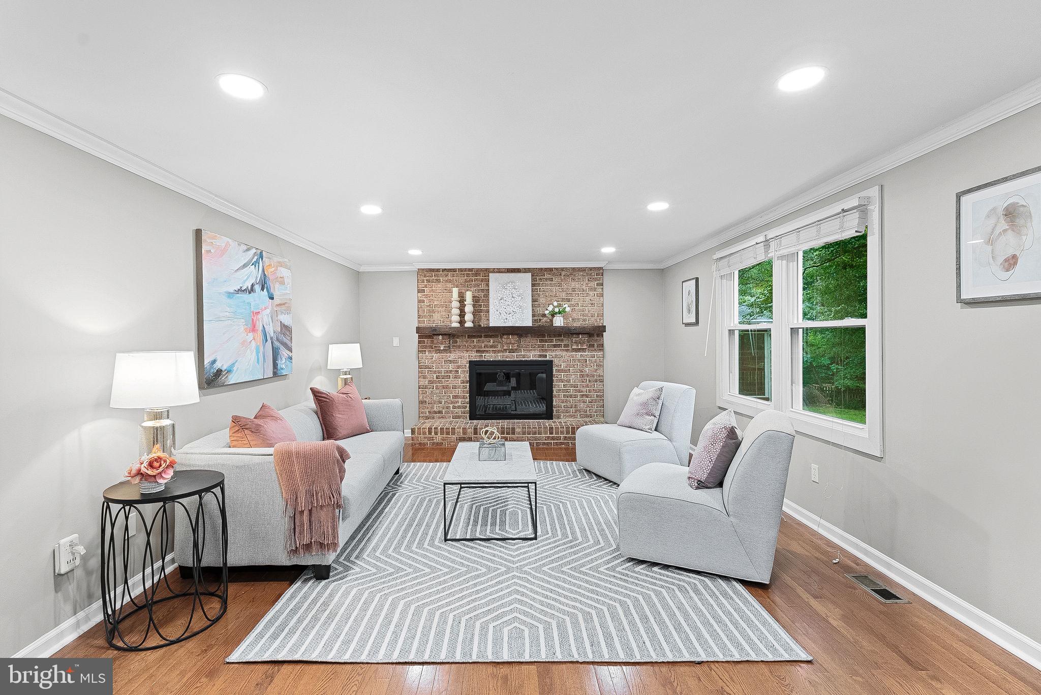 128 Applegate Drive Sterling, VA 20164 - Photo 13 of 58 a living room with furniture and a fireplace