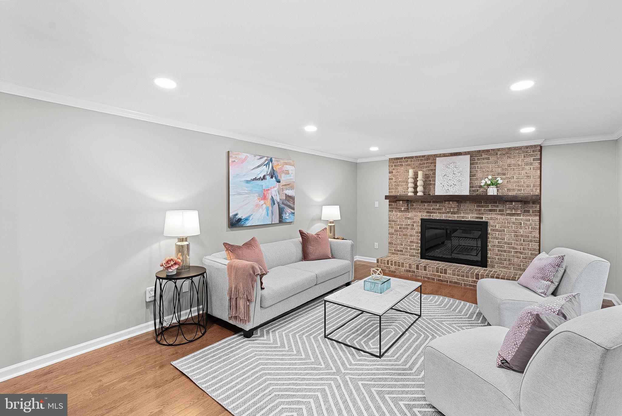 128 Applegate Drive Sterling, VA 20164 - Photo 15 of 58 a living room with furniture and a fireplace
