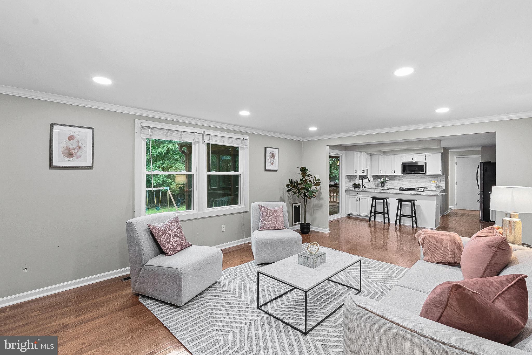128 Applegate Drive Sterling, VA 20164 - Photo 16 of 58 a living room with furniture and a large window