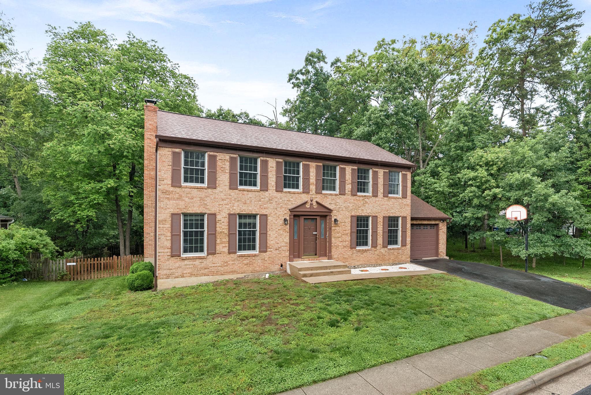 128 Applegate Drive Sterling, VA 20164 - Photo 2 of 58 front view of a house with a yard