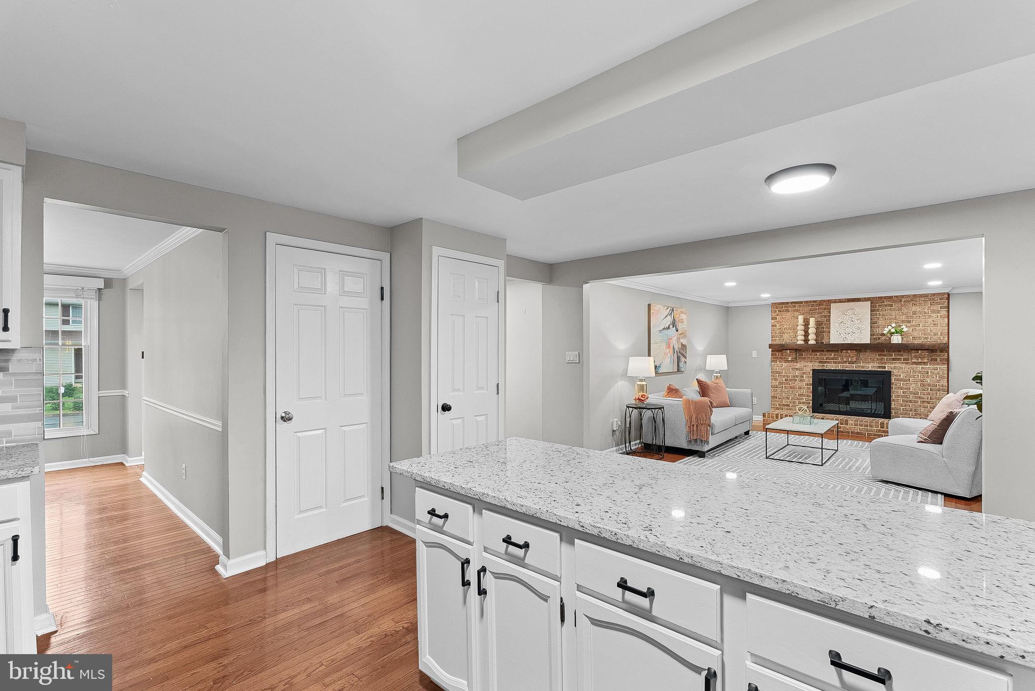 128 Applegate Drive Sterling, VA 20164 - Photo 22 of 58 a kitchen with counter top space cabinets and wooden floor