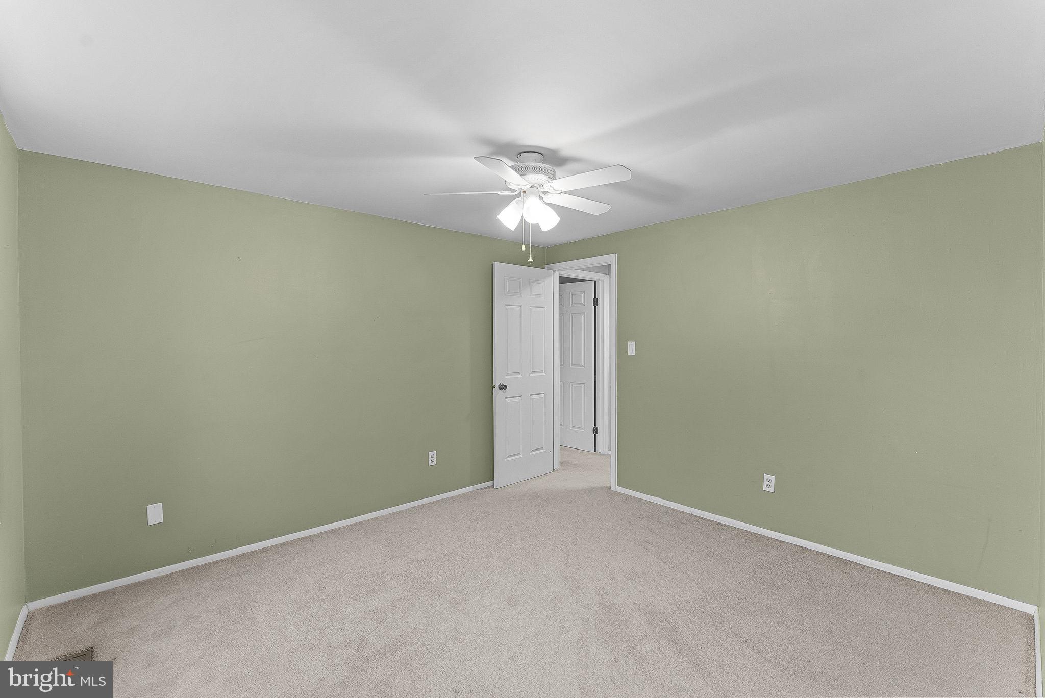 128 Applegate Drive Sterling, VA 20164 - Photo 40 of 58 an empty room with a ceiling fan and a window