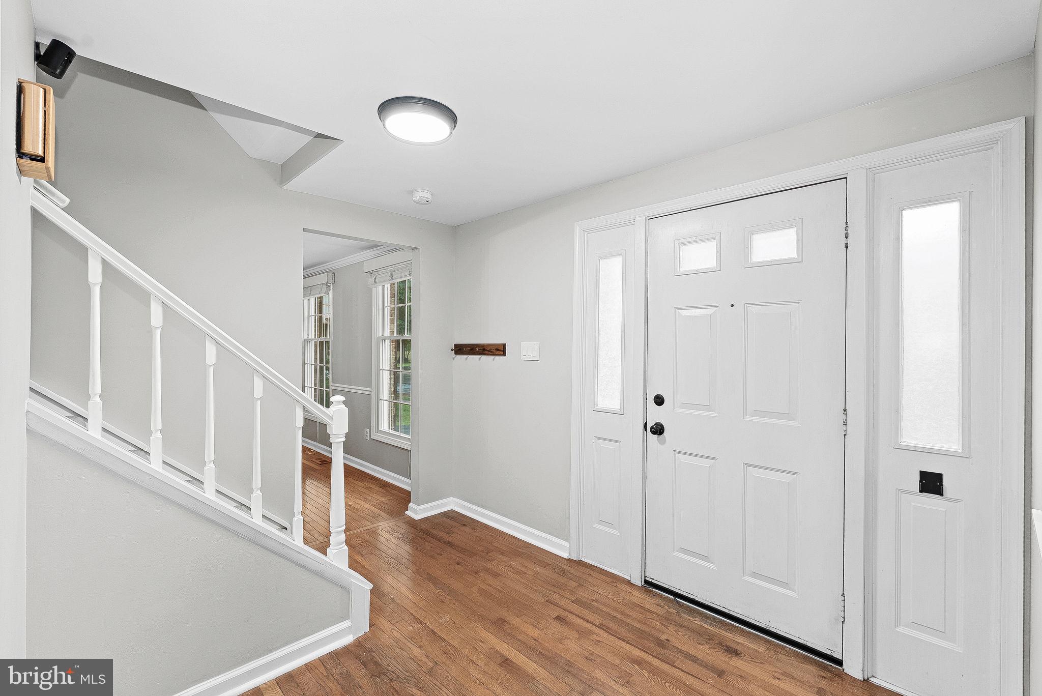 128 Applegate Drive Sterling, VA 20164 - Photo 4 of 58 a view of entryway with wooden floor