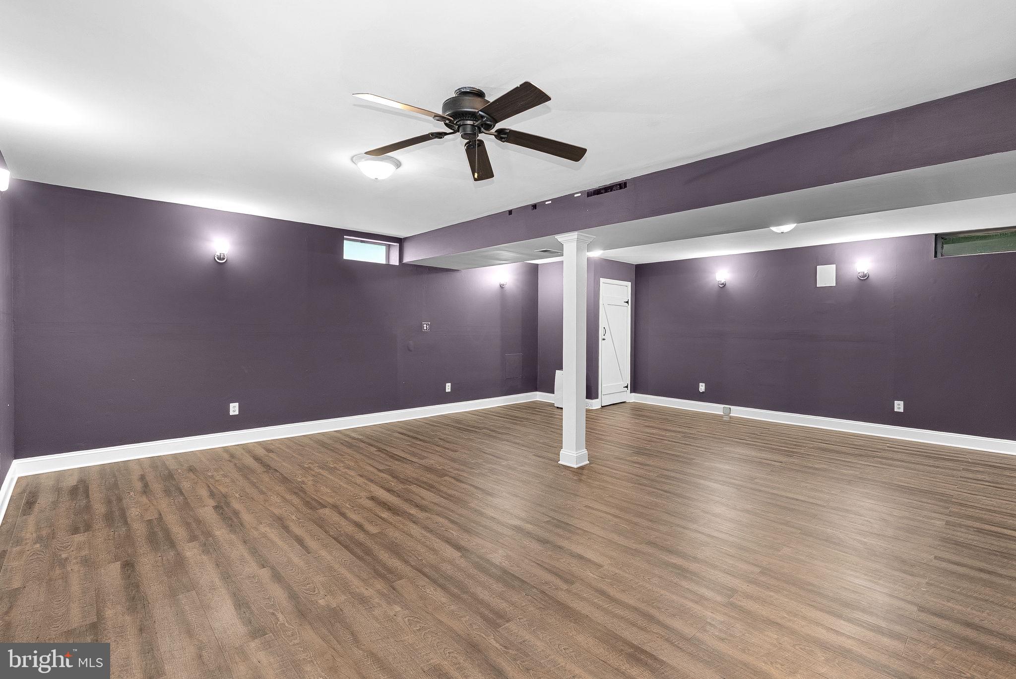 128 Applegate Drive Sterling, VA 20164 - Photo 44 of 58 a view of an empty room with a chandelier fan