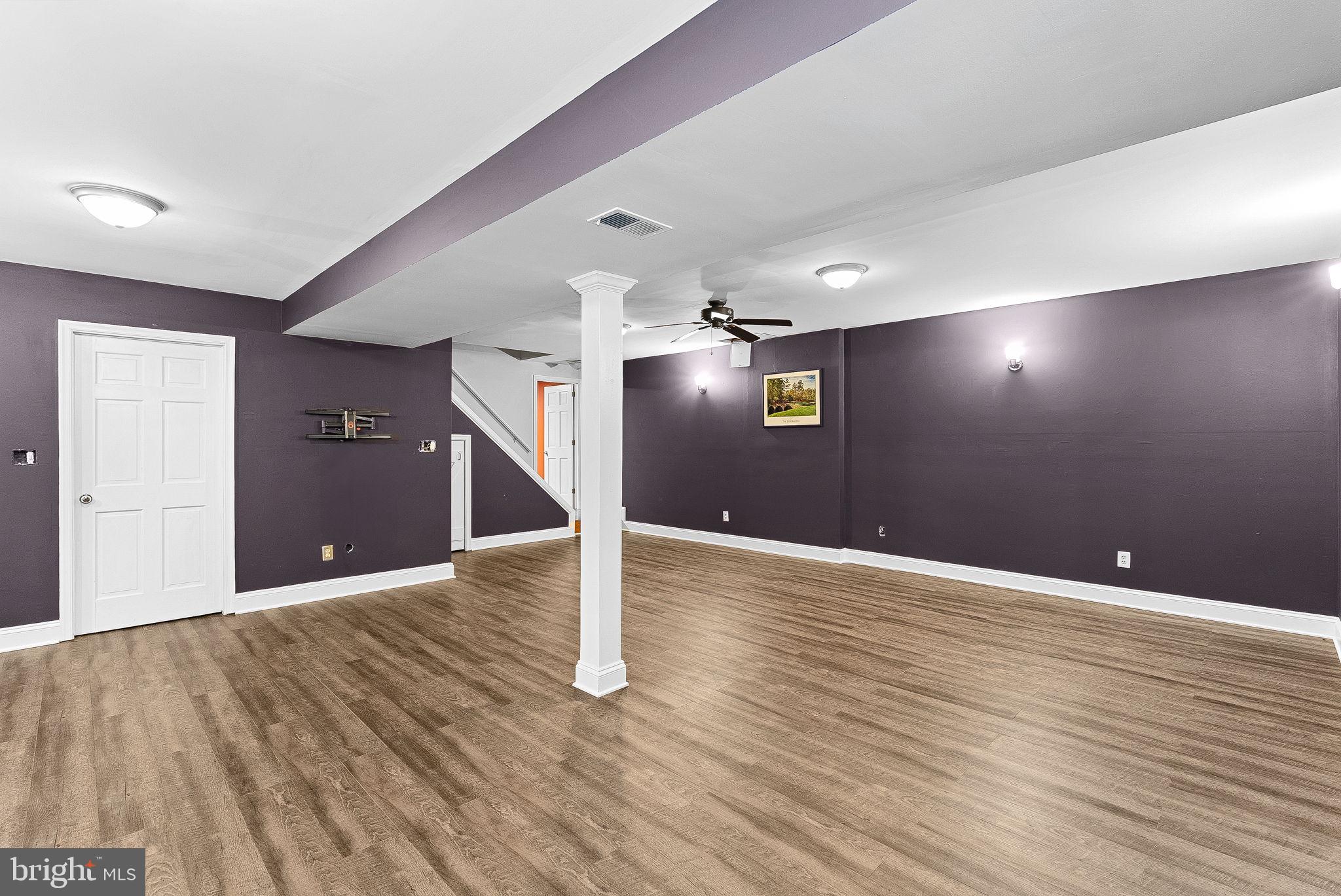 128 Applegate Drive Sterling, VA 20164 - Photo 46 of 58 a view of an empty room with wooden floor
