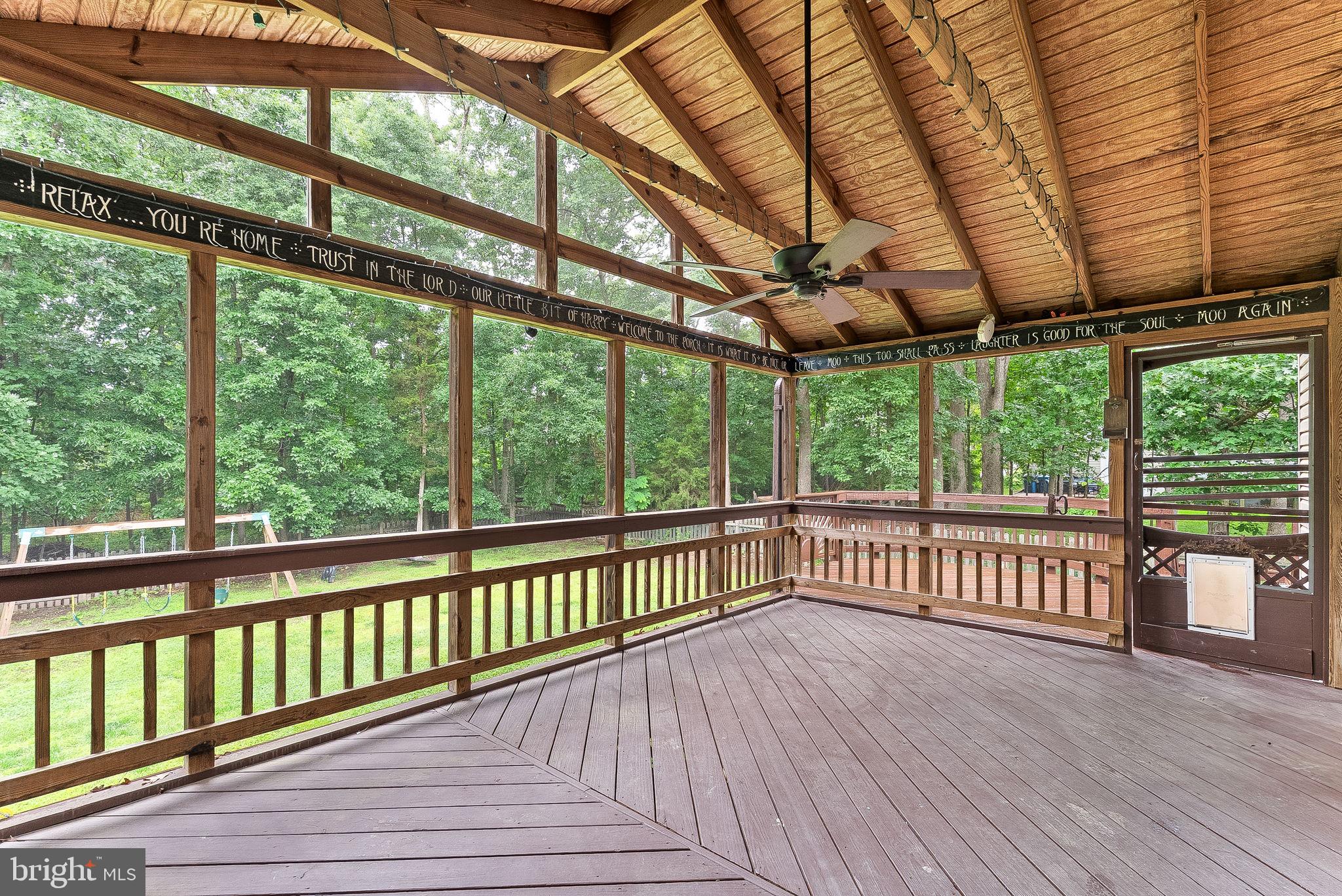 128 Applegate Drive Sterling, VA 20164 - Photo 51 of 58 a view of a porch with wooden floor in front of a house