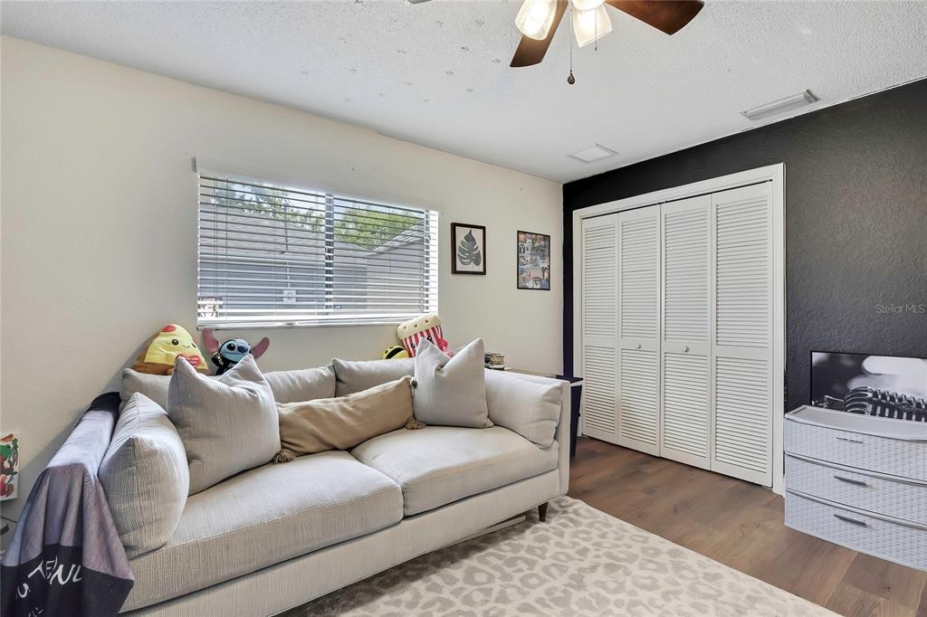 14154 Trollman Street Spring Hill, FL 34609 - Photo 15 of 25 a living room with furniture and a window