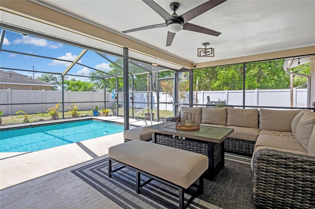 14154 Trollman Street Spring Hill, FL 34609 - Photo 23 of 25 a living room with furniture and a large window
